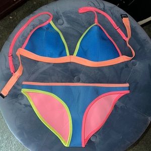 Triangl Bikini. Multi color. Size medium top and bottom.